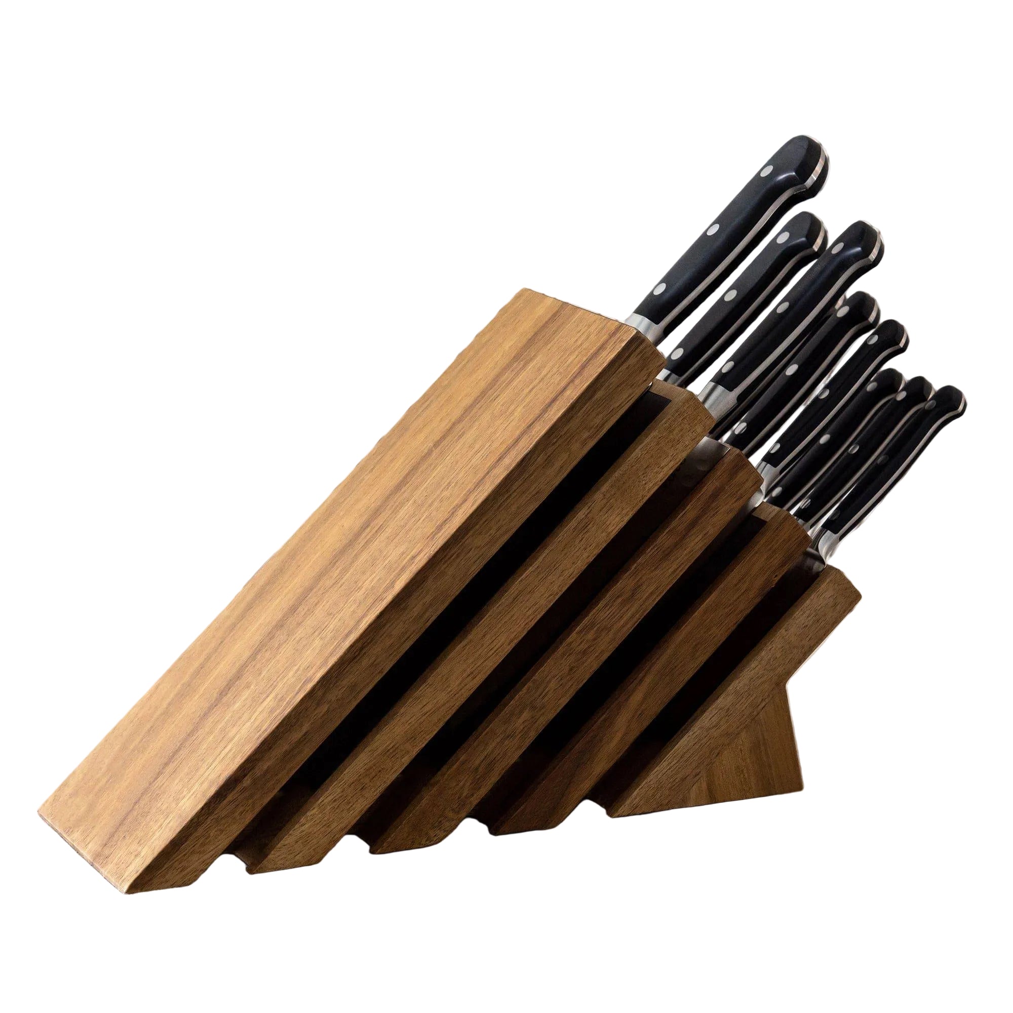 Set of knives in a wooden block on a neutral background