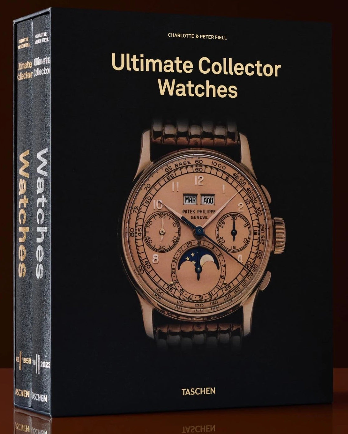 Book titled 'Ultimate Collector Watches' by Taschen on a dark background
