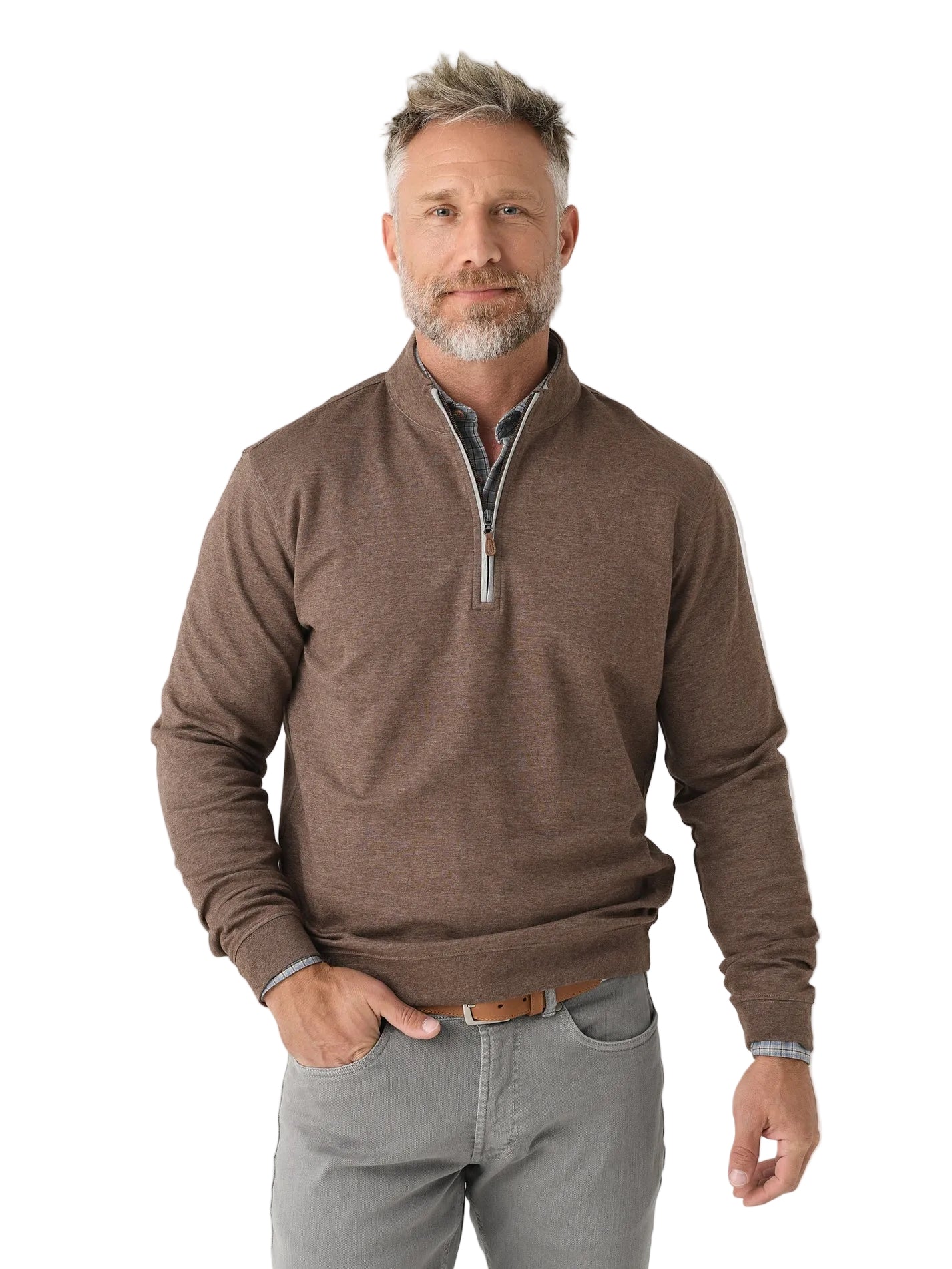 Man wearing a brown sweater and gray pants on a white background