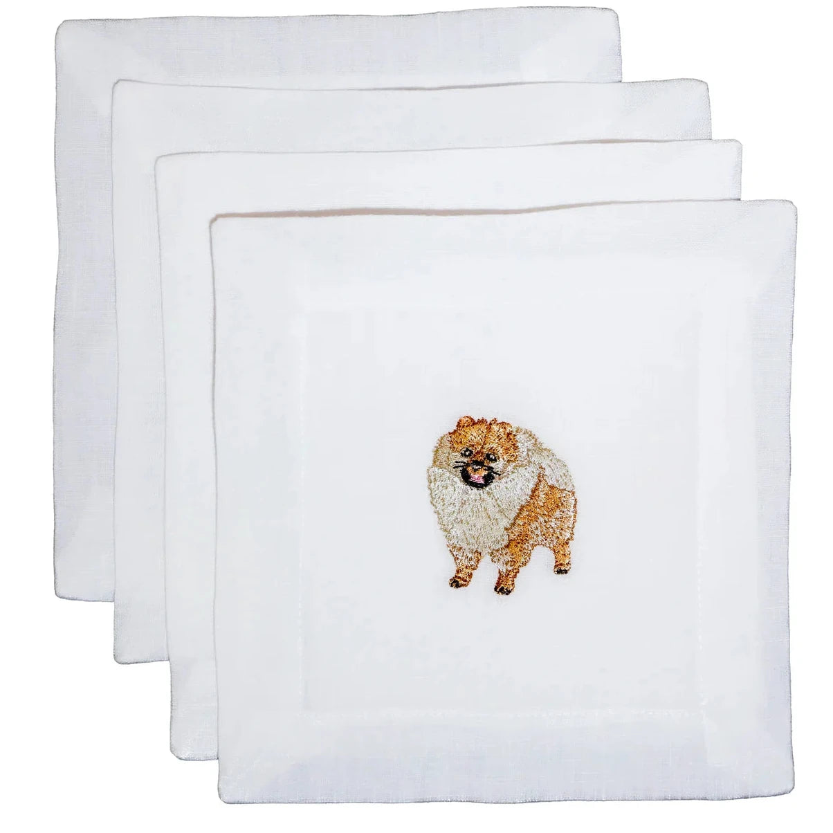 Set of three white towels with embroidered dog designs on a white background
