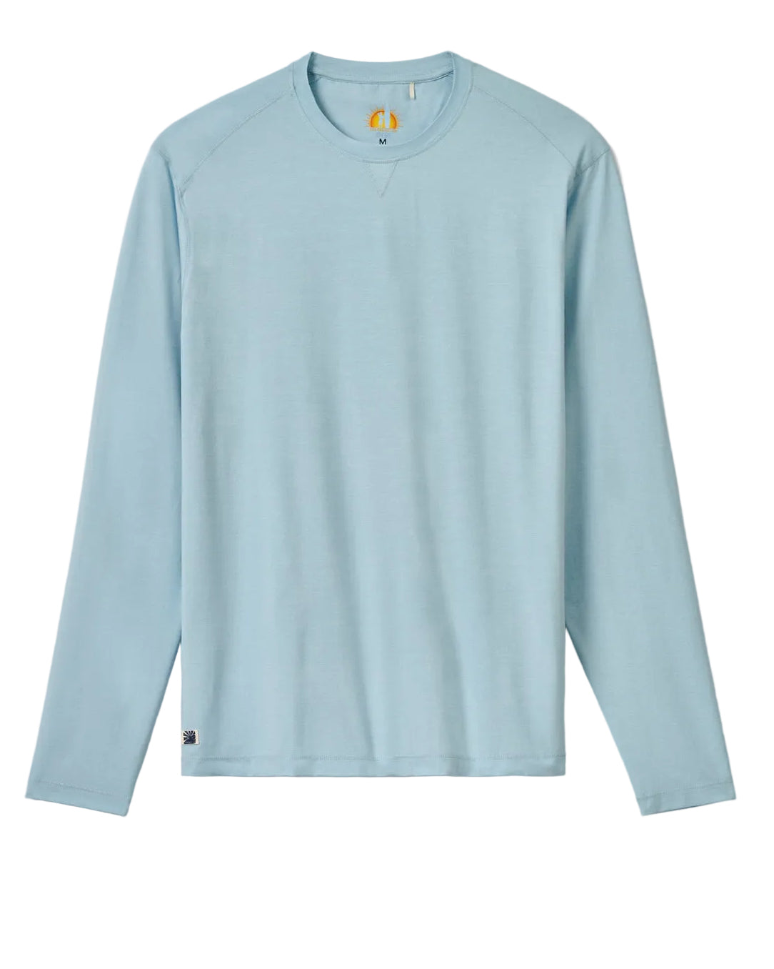 Light blue long-sleeve shirt on a beige background