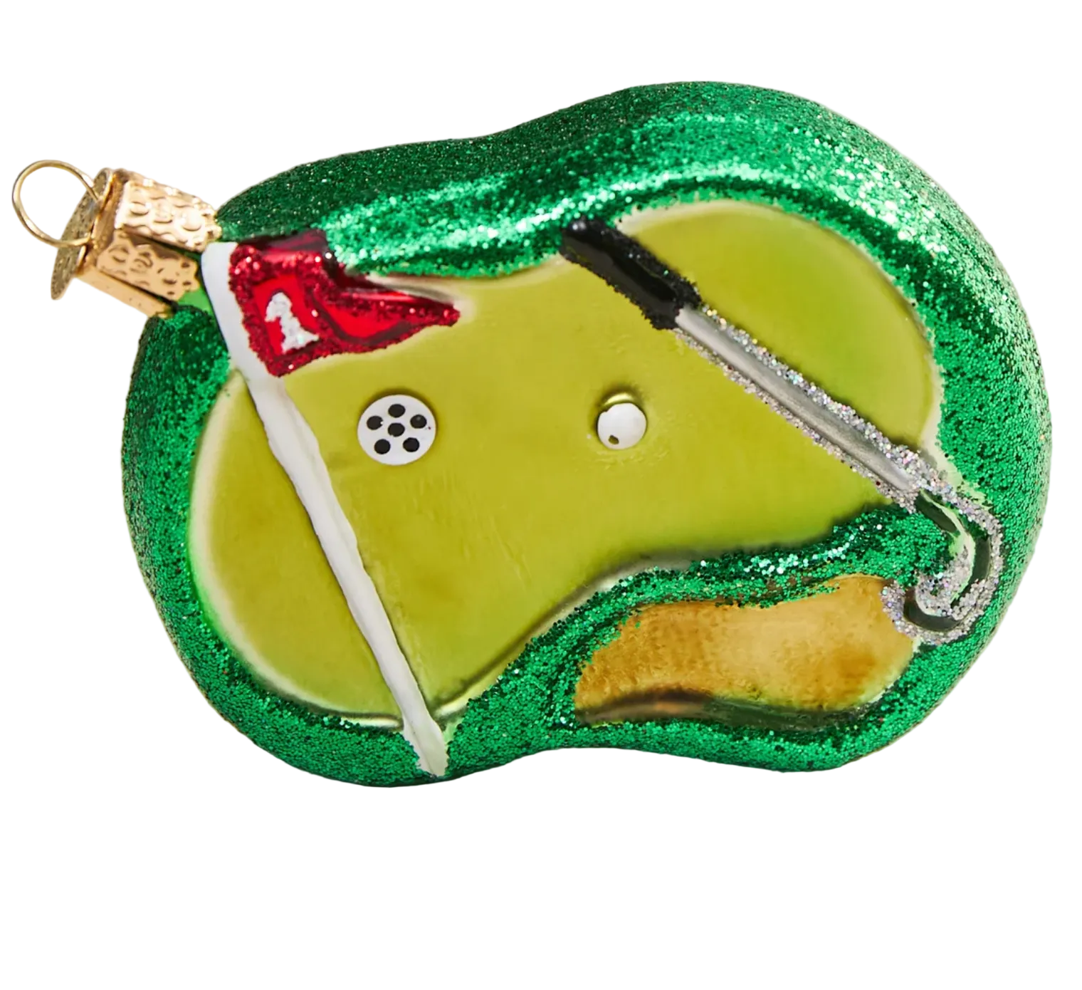 Golf ornament with green glitter, white ball, and red flag on a beige background