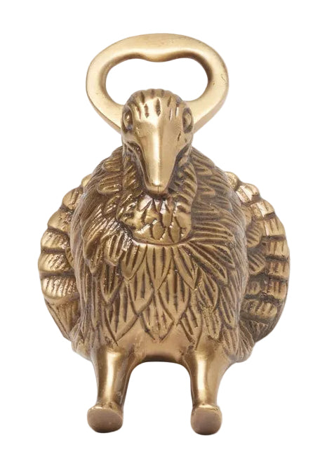 Brass bottle opener shaped like a hedgehog on a white background