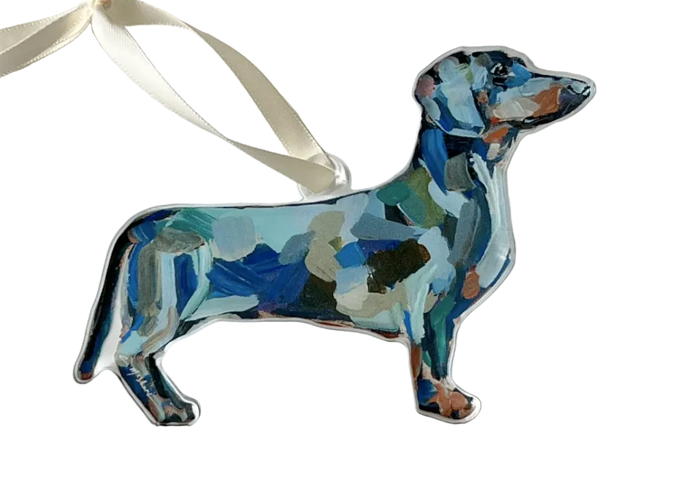 Decorative ornament shaped like a dachshund with a colorful abstract pattern on a white background.