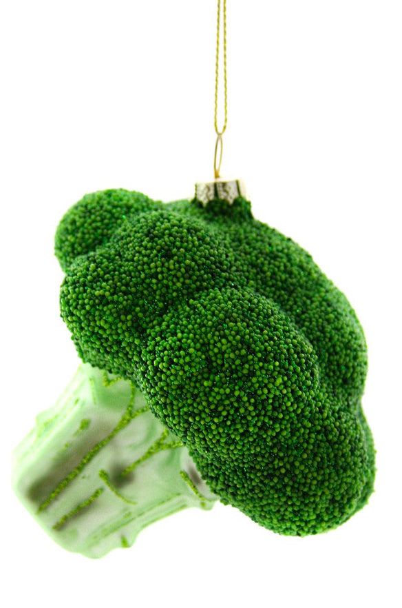 A glass ceiling light fixture in the shape of a broccoli with green leaves, suspended by a gold chain.