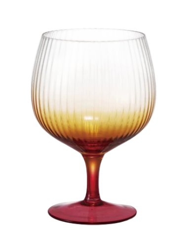 Gradient wine glass with red at the base and yellowish-orange at the top on a white background