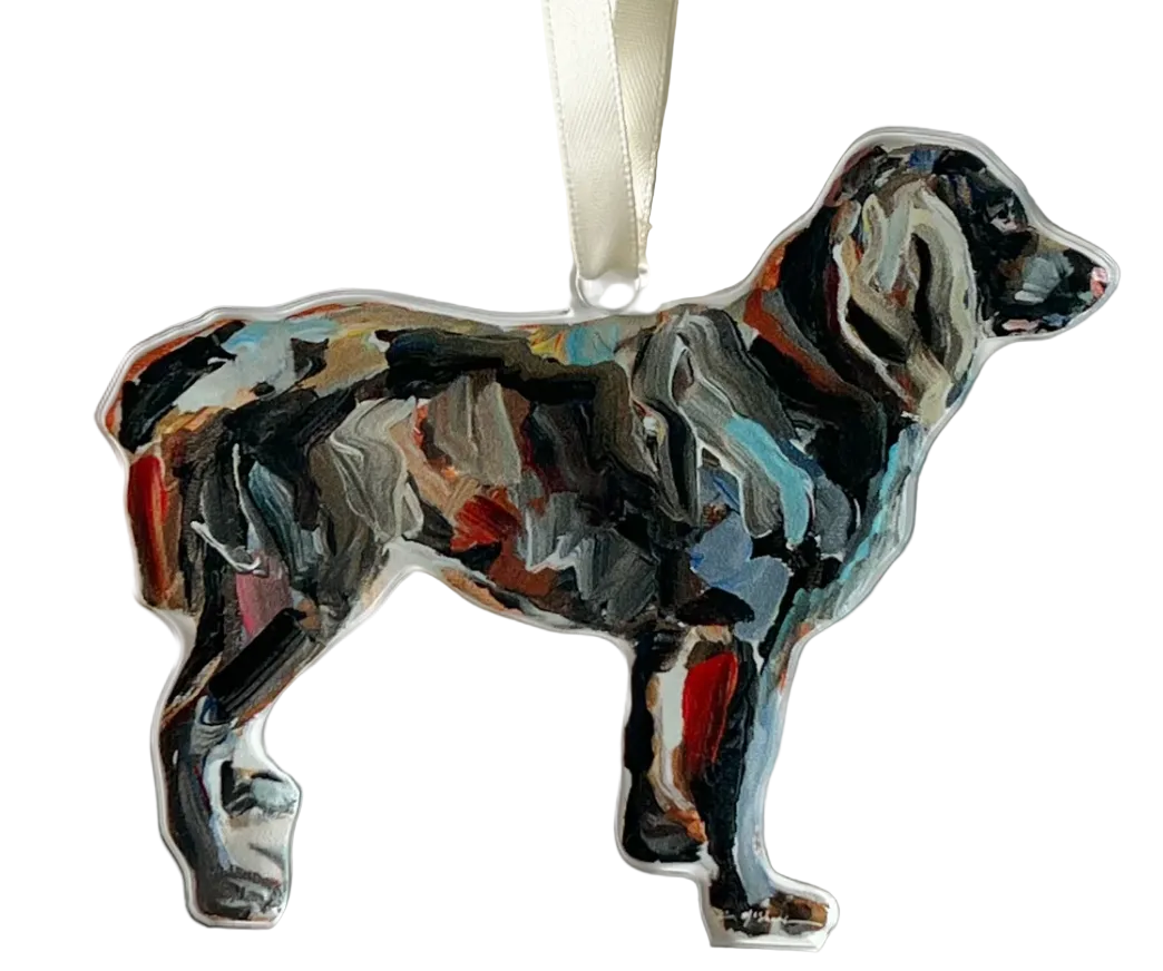Acrylic ornament depicting a blurred image of a dog, with a ribbon at the top.