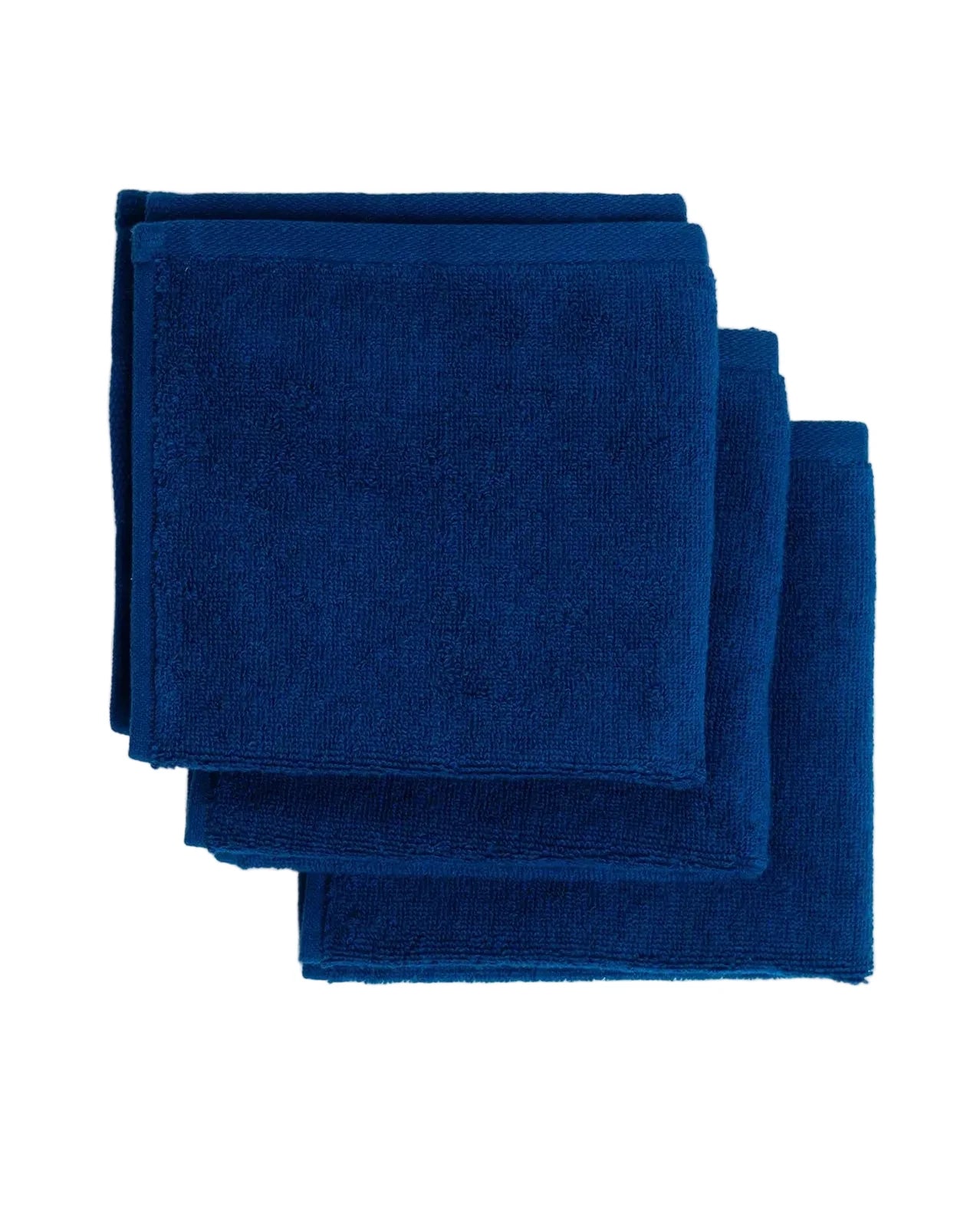 Stack of blue towels on a white background