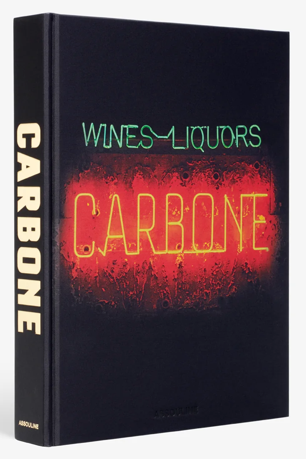 A cover image of a book titled 'Carbone' featuring a neon sign style graphic with the text 'Wines-Liquors CARBONE' on a dark background.