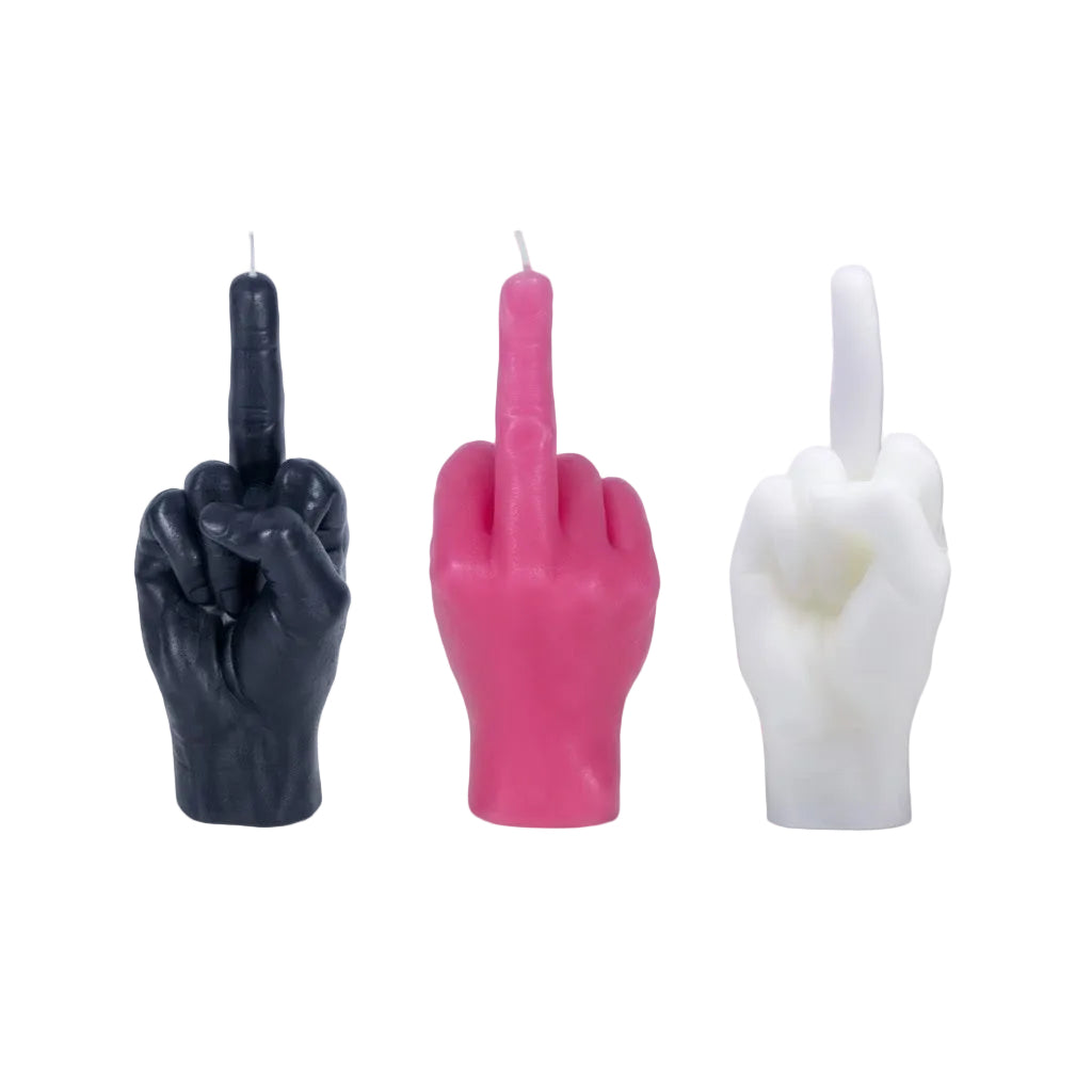 Three hand-shaped candles in black, pink, and white on a white background