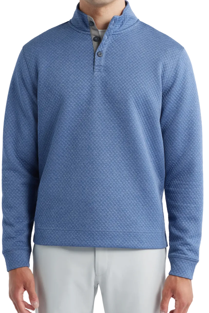 Blue textured pullover worn by a person on a light gray background
