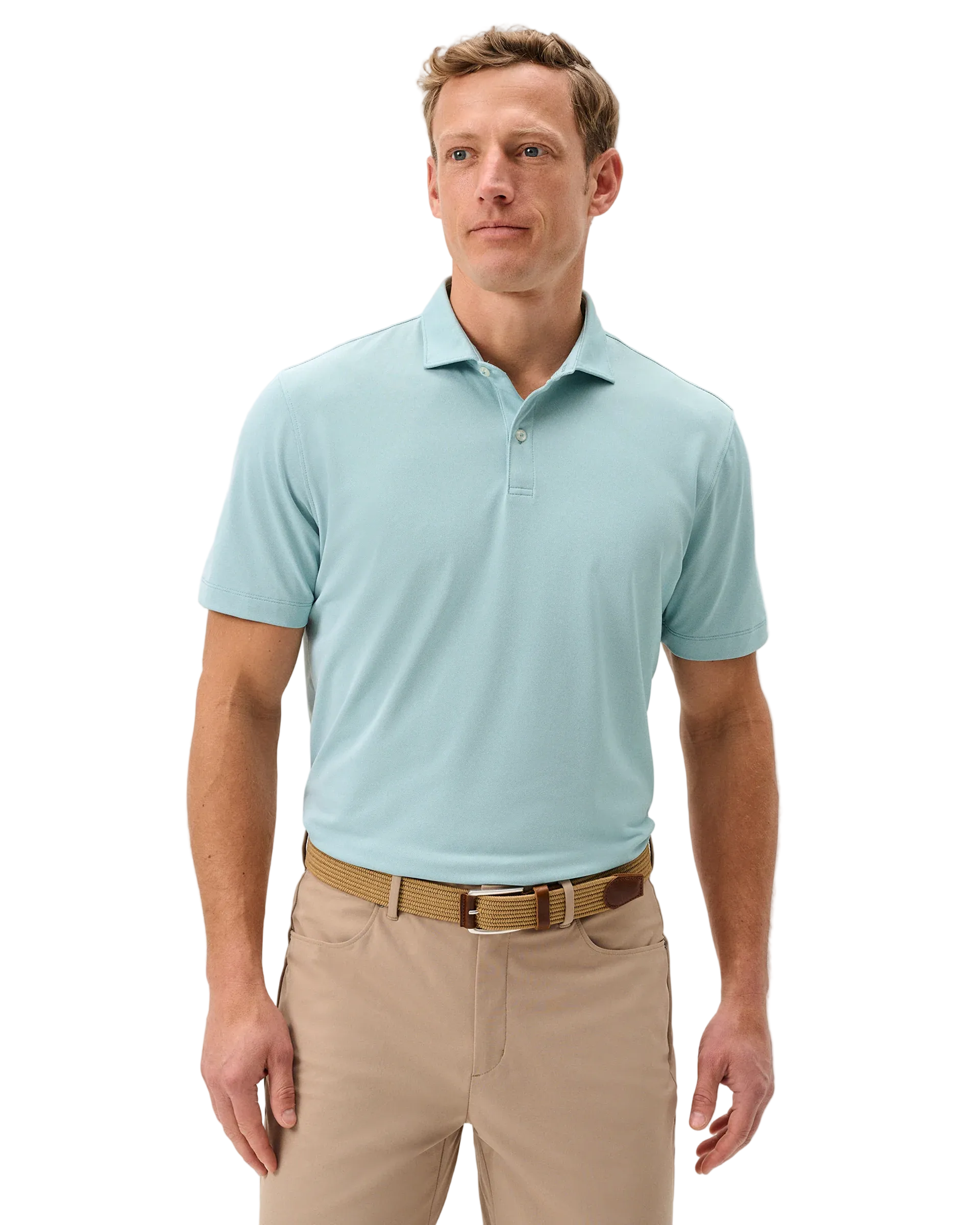 Man wearing a light blue polo shirt and beige pants on a plain background