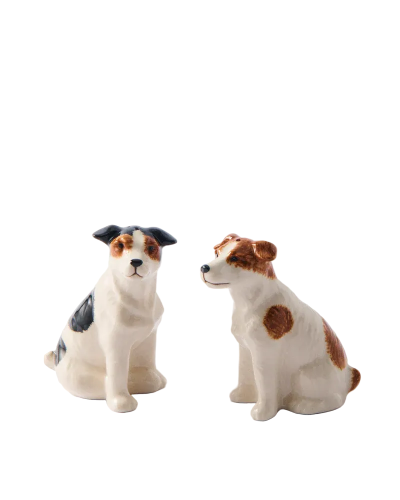 Two ceramic dog figurines on a white background