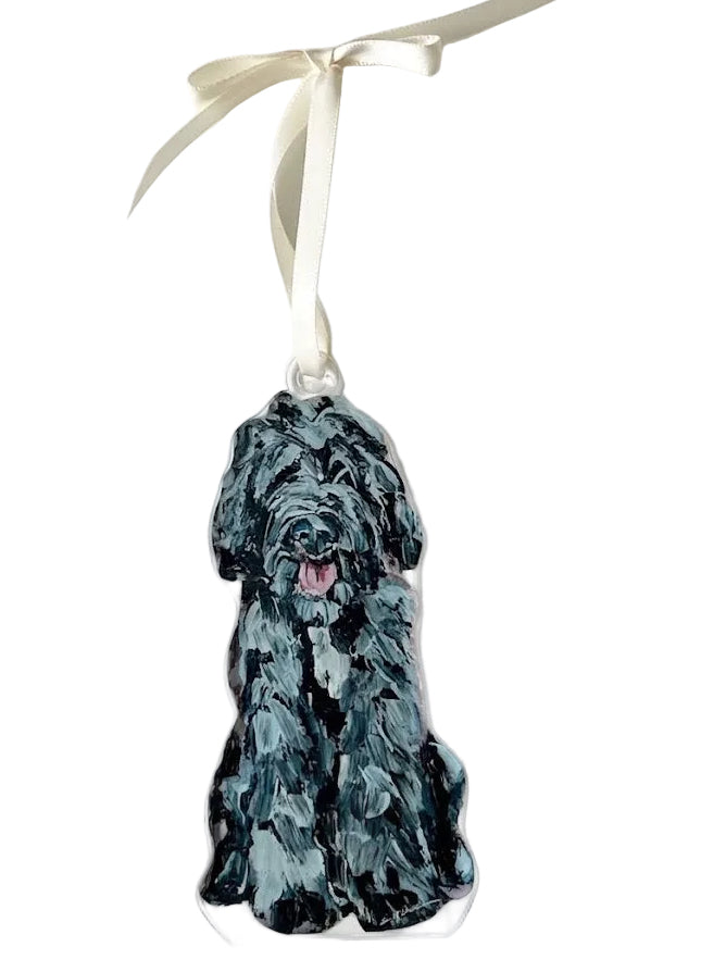 Dog-shaped ornament with a black and gray pattern on a white background