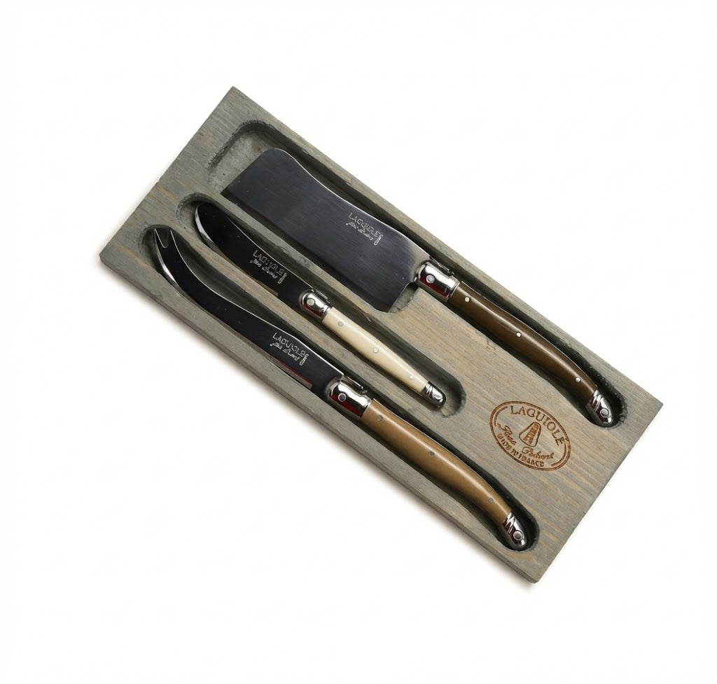 Set of Laguiole knives in a wooden box on a white background