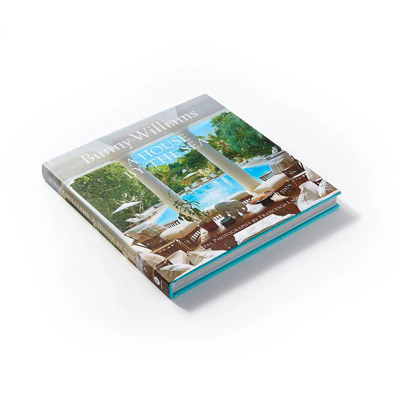Book titled 'A House By The Sea' by Bunny Williams on a white background