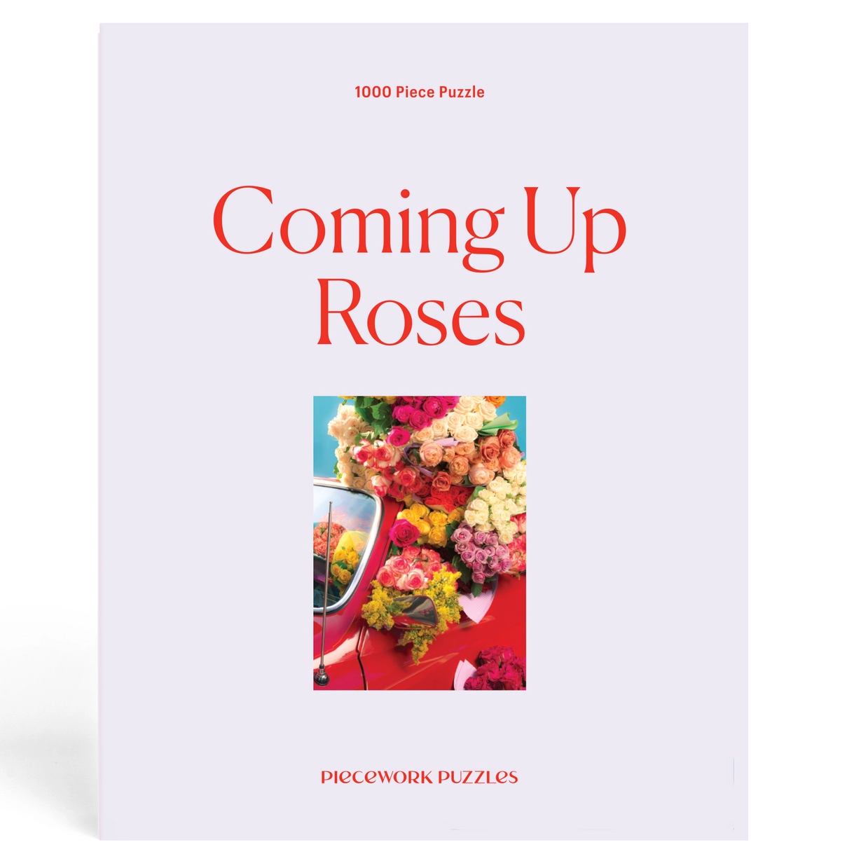 Puzzle box titled 'Coming Up Roses' with a floral design on a white background