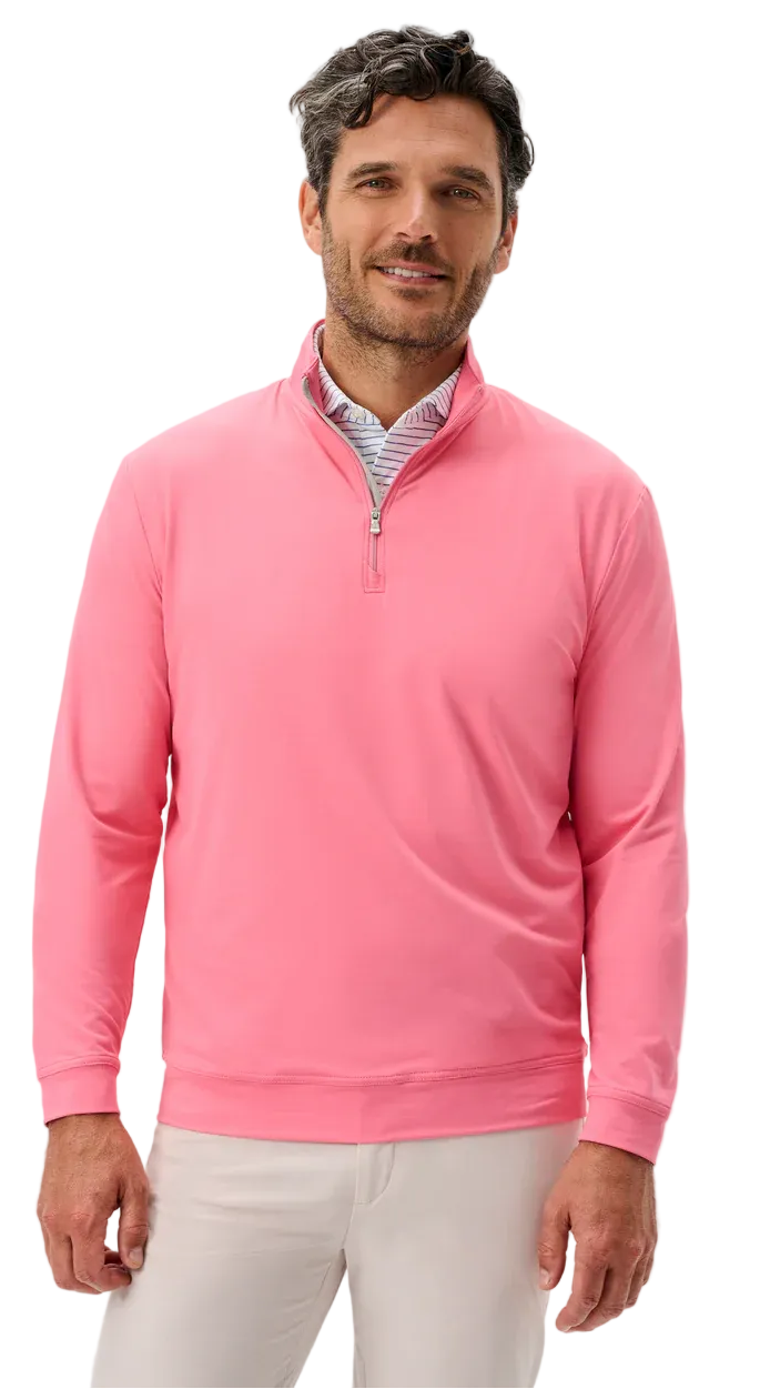 Man wearing a pink pullover with a white background