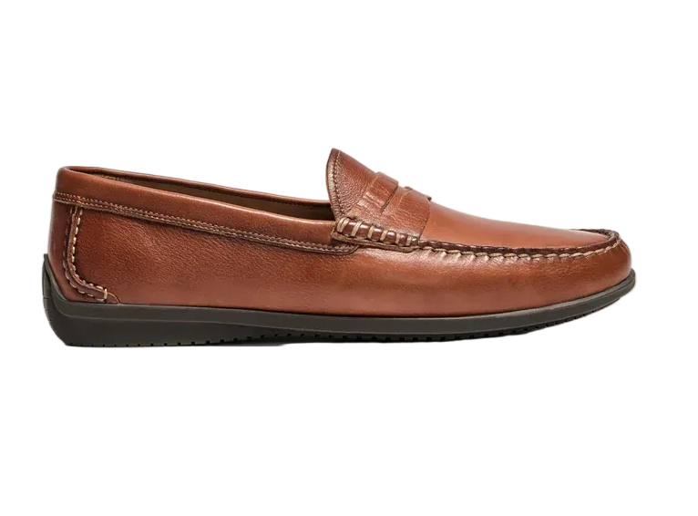 A single brown leather penny loafer shown in profile against a light gray studio background.
