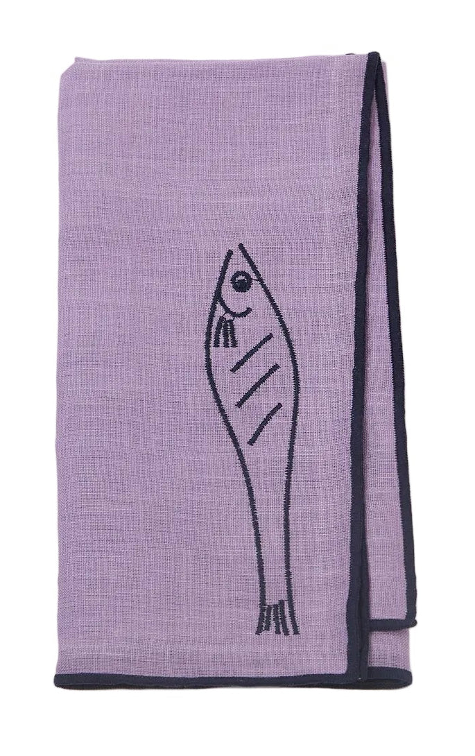 Purple towel with fish design on a white background
