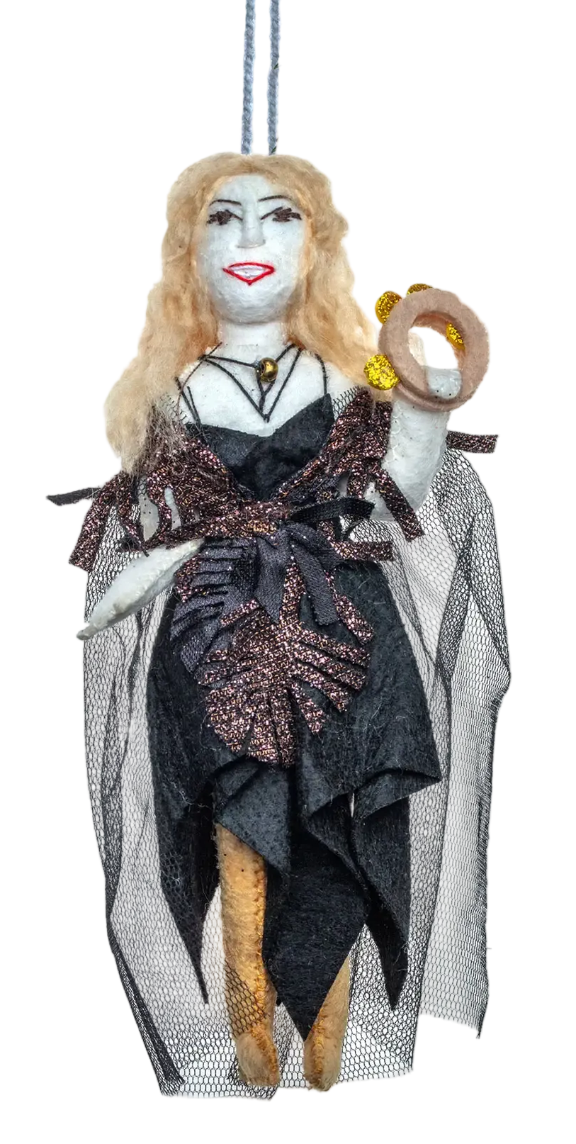 A hanging Christmas ornament shaped like a woman with blonde hair, a black and brown patterned dress, and a gray veil, suspended by a string beneath pine branches against a white background.