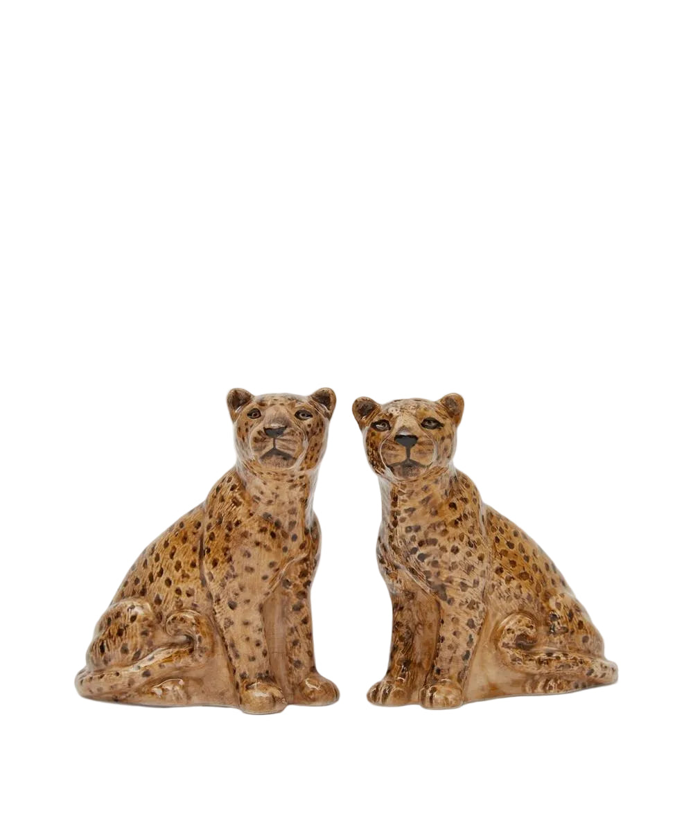 Two ceramic cheetah figurines on a white background