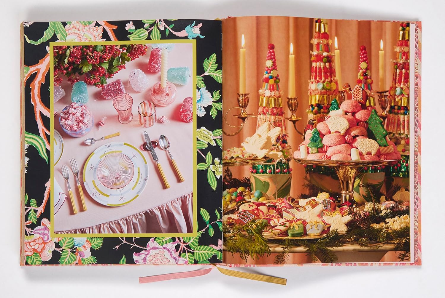 Book open to a page with images of a festive table setting and dessert display.