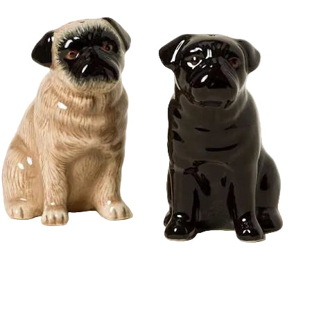 Two ceramic pug figurines, one beige and one black, on a white background.