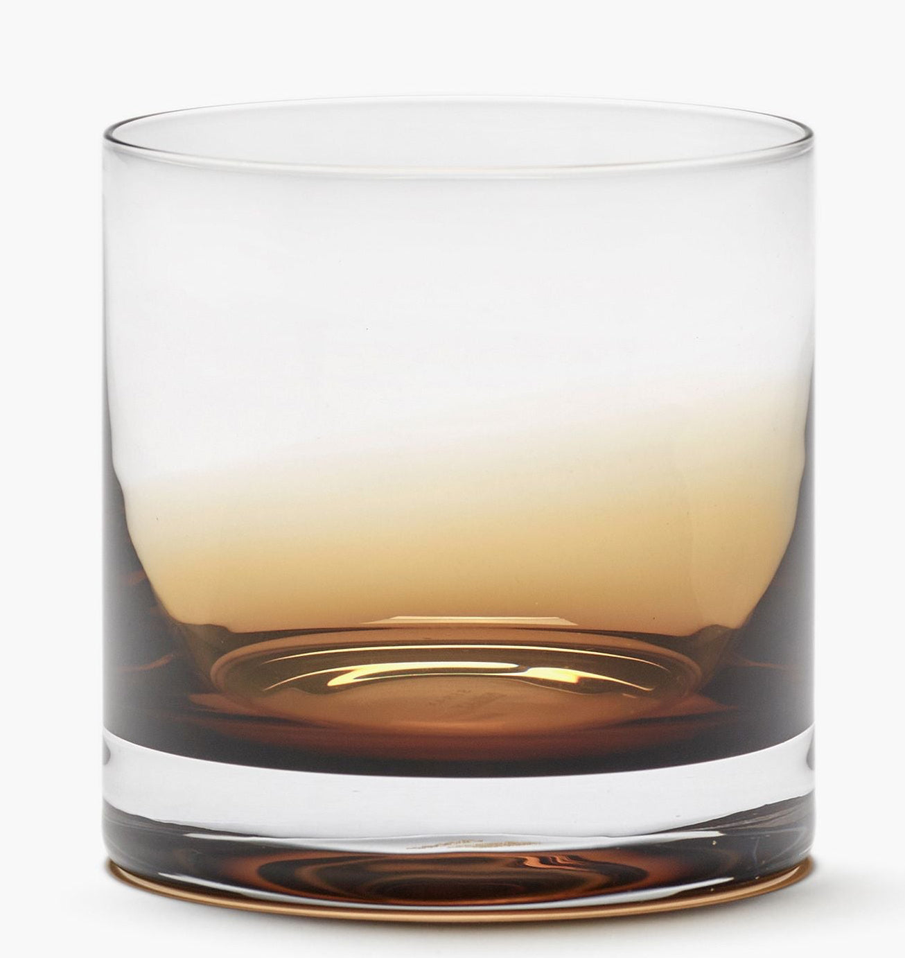 A clear glass rocks tumbler with a frosted top half and a thick clear base, partially filled with an amber-brown liquid, shown on a clean white background.