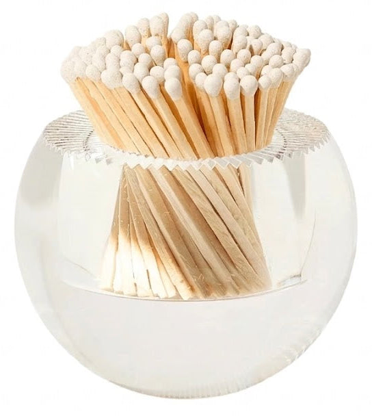 Clear spherical container filled with wooden matches on a white background