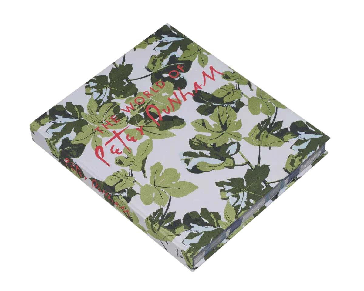 Notebook with green leaf pattern and 'Peter Dunham' branding on a white background