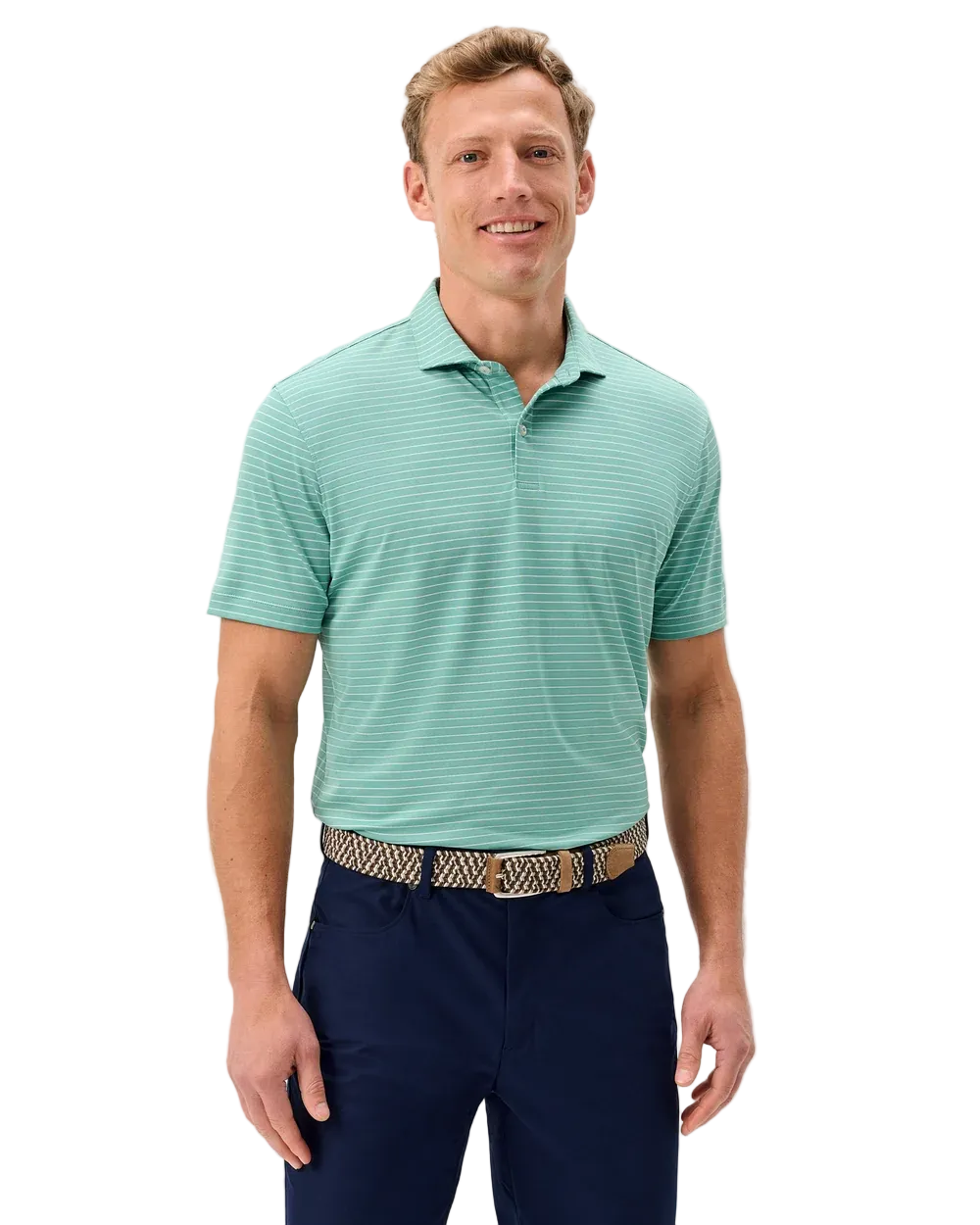 Man wearing a green striped polo shirt and navy pants on a light gray background