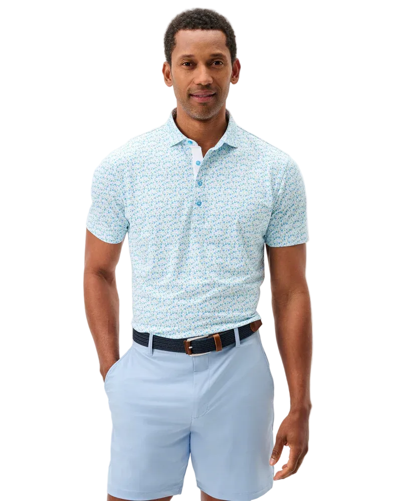 Man wearing a light blue patterned polo shirt and shorts on a white background