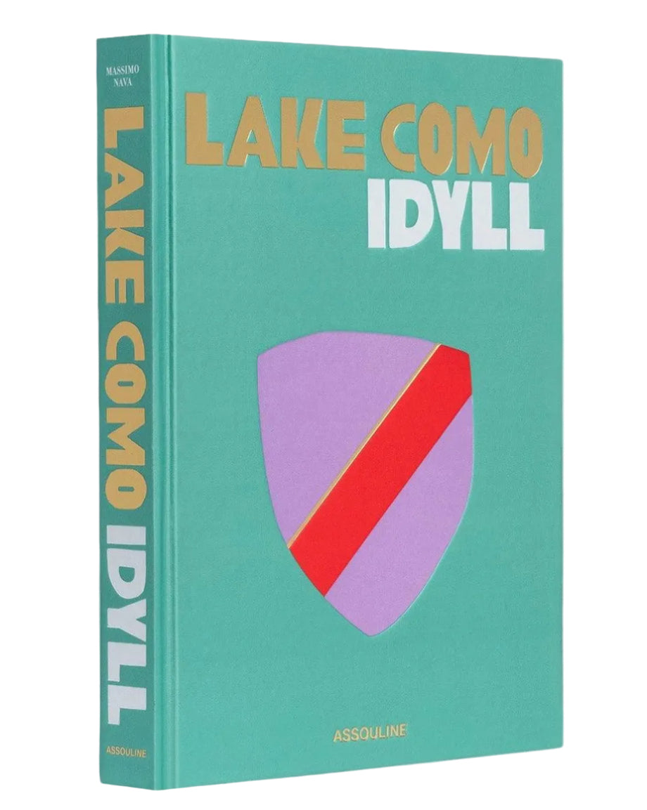 Book titled 'Lake Como Idyll' with a colorful design on a white background