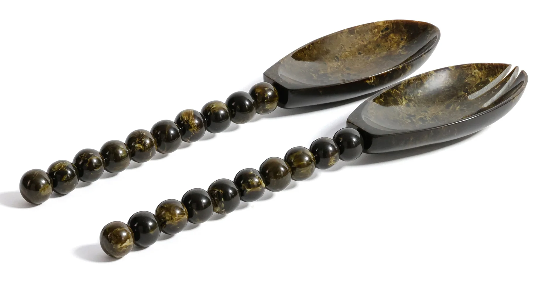 Two decorative spoons with beaded handles on a white background