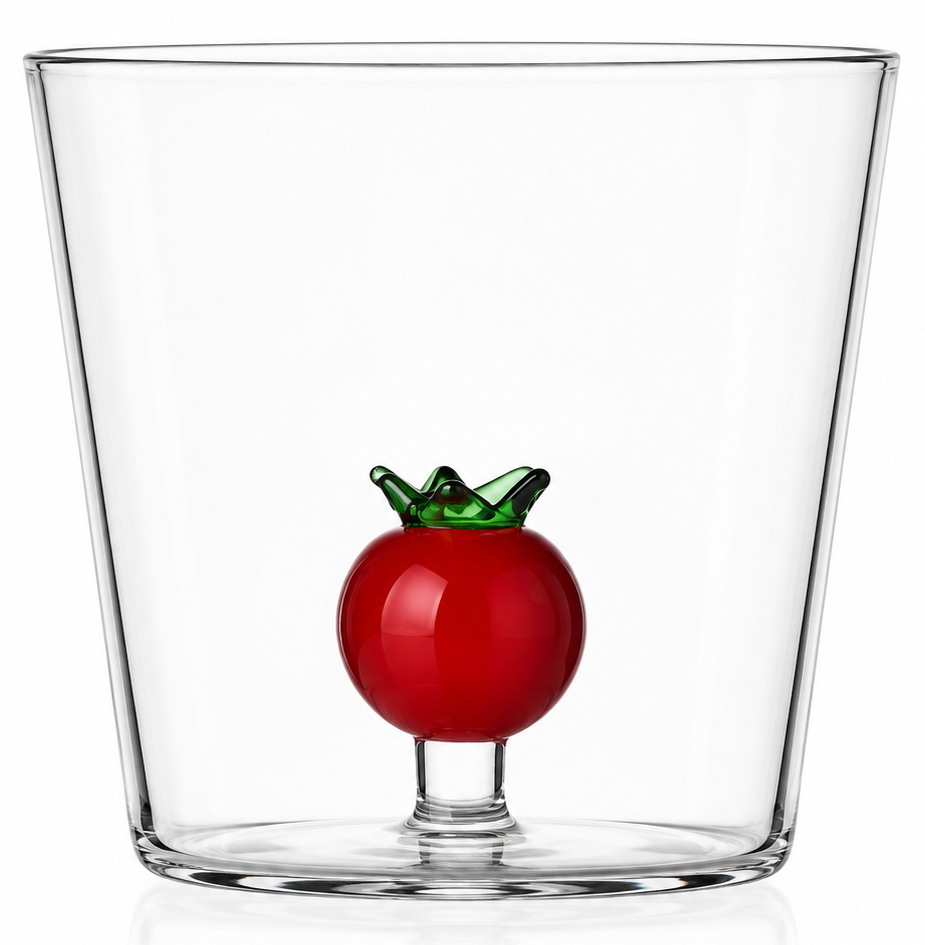 A clear glass tumbler with a small red tomato-shaped decoration and green leaf detail at the base, shown on a clean white background.