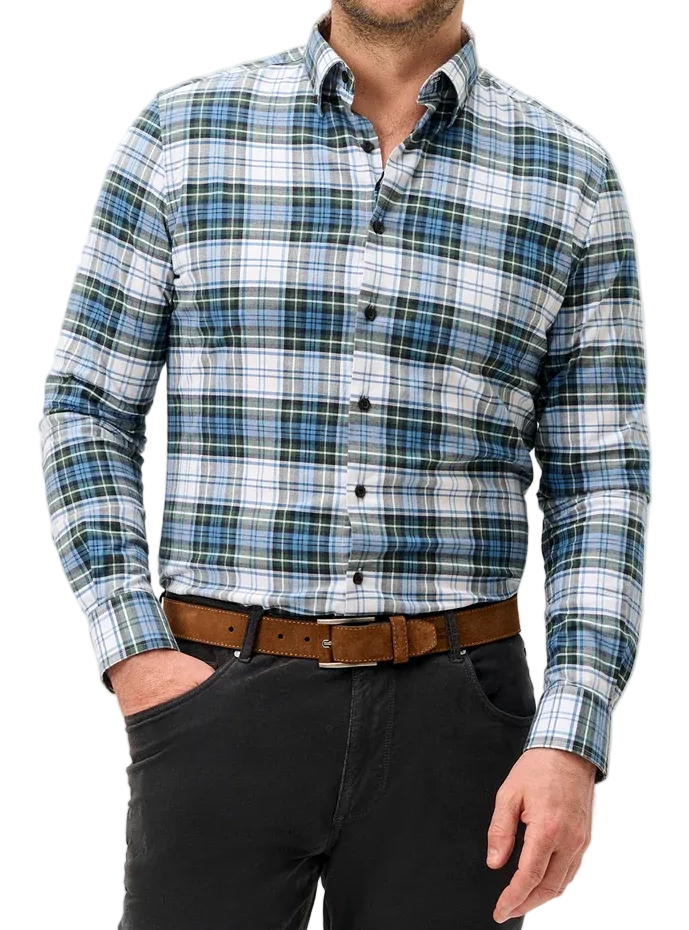 A man wearing a long-sleeve button-down plaid shirt in blue, green, and white, paired with a brown belt and dark gray trousers, standing against a light gray studio background.
