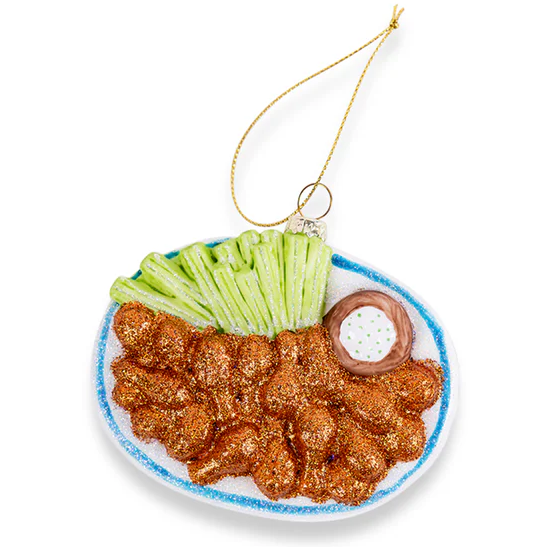Fried chicken with pickles and sauce on a white background