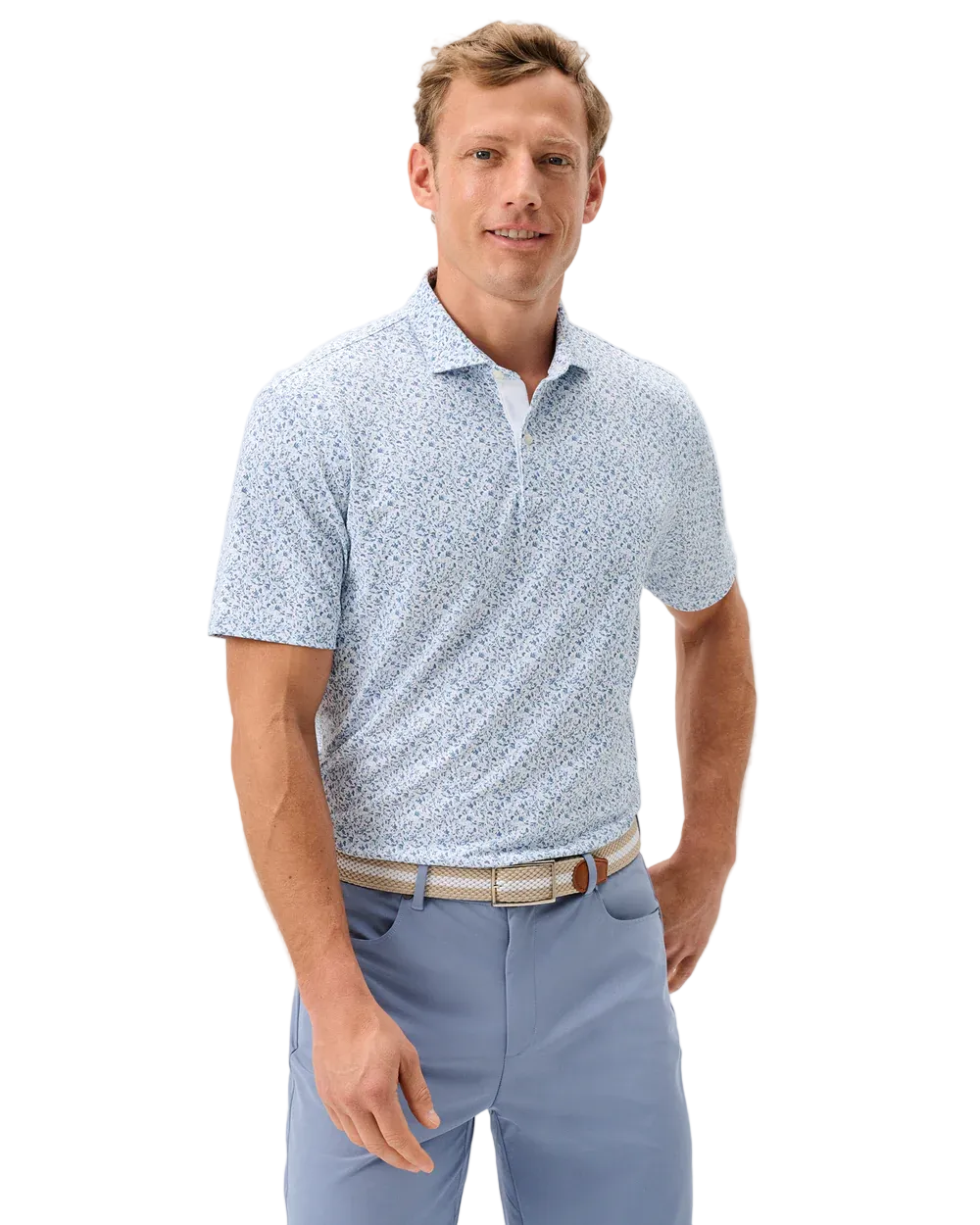 Man wearing a light blue patterned polo shirt and light blue pants on a white background