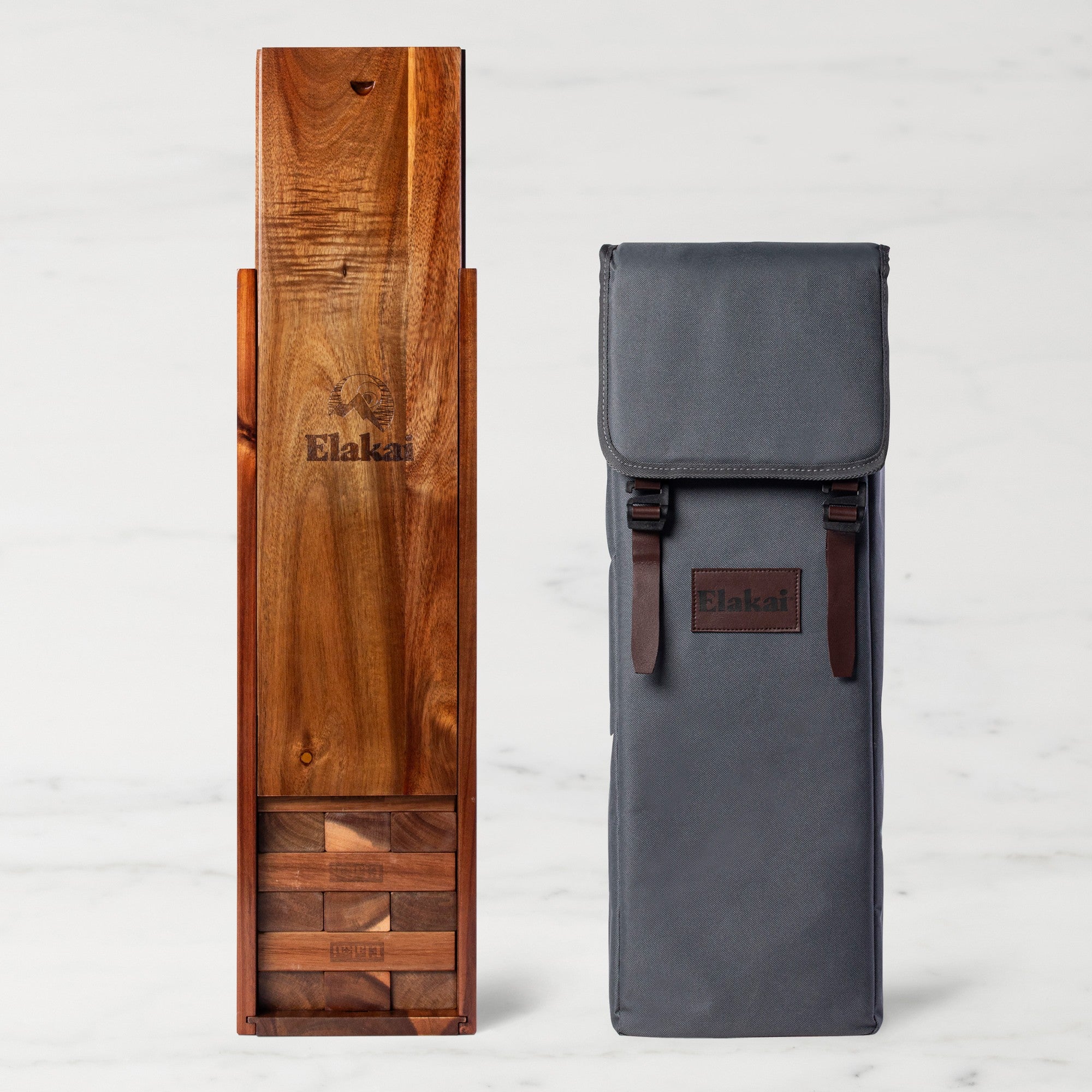 Wooden and gray bags with 'Elakal' branding on a light gray background