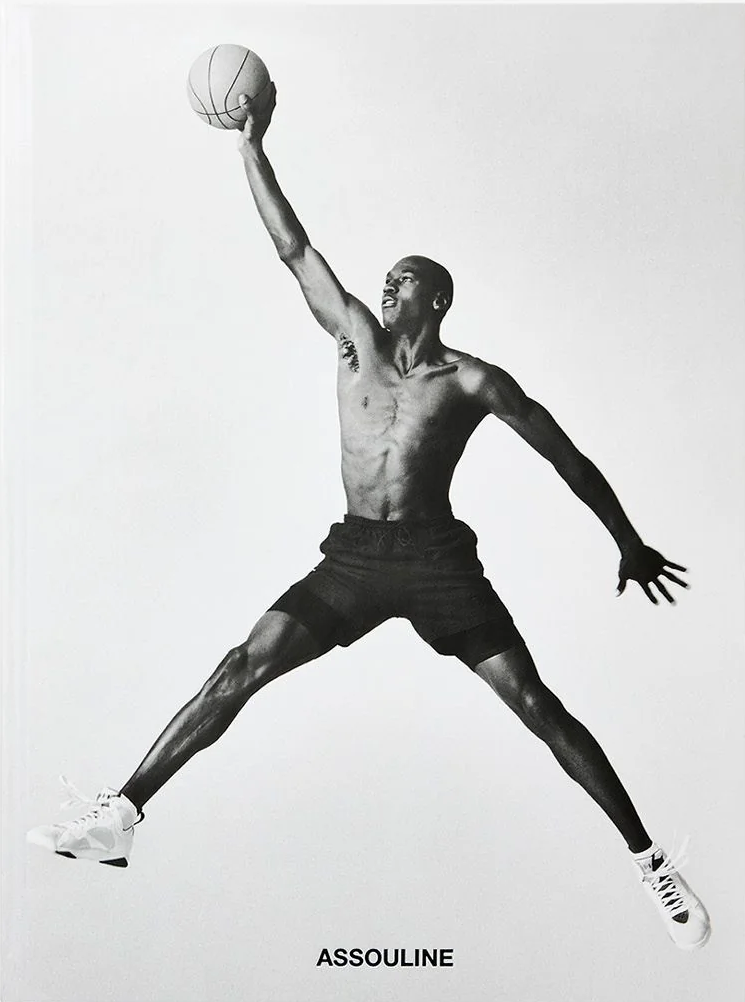 Book cover with a black and white illustration of a basketball player in mid-air, holding a ball, on a white background. The brand 'Assouline' is visible at the bottom.