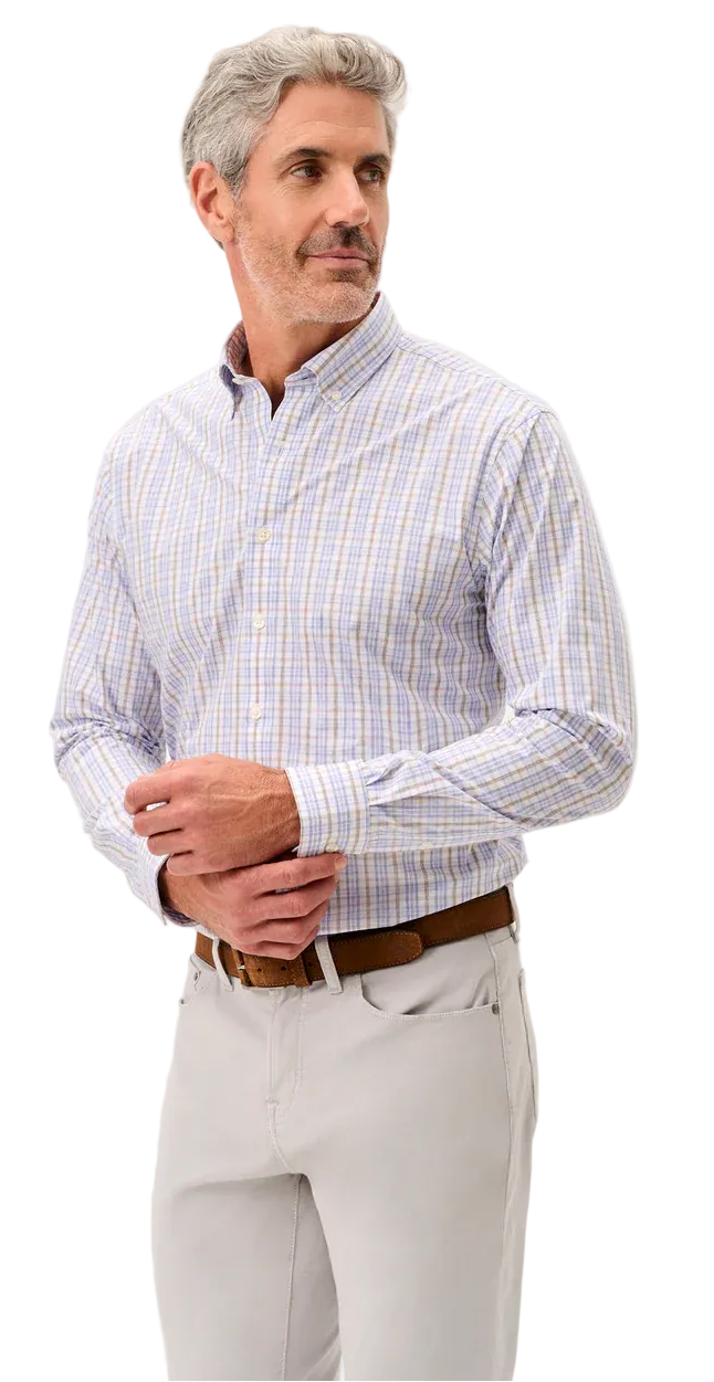Man wearing a checkered shirt and light pants on a white background