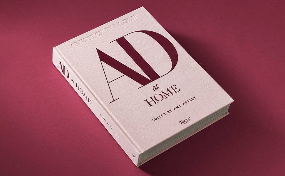 Book titled 'AD at Home' on a maroon background