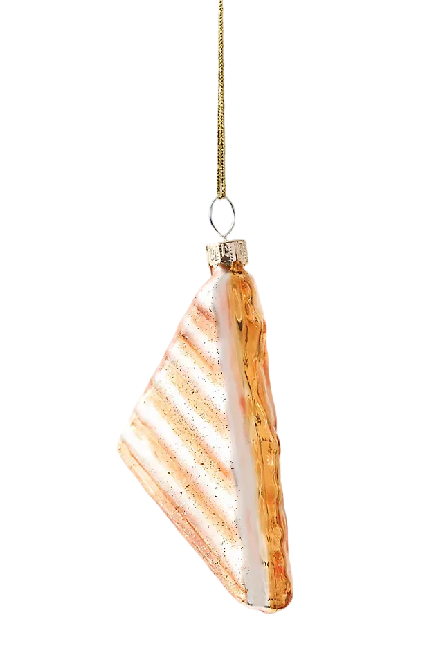 Decorative glass ornament with striped pattern on a neutral background