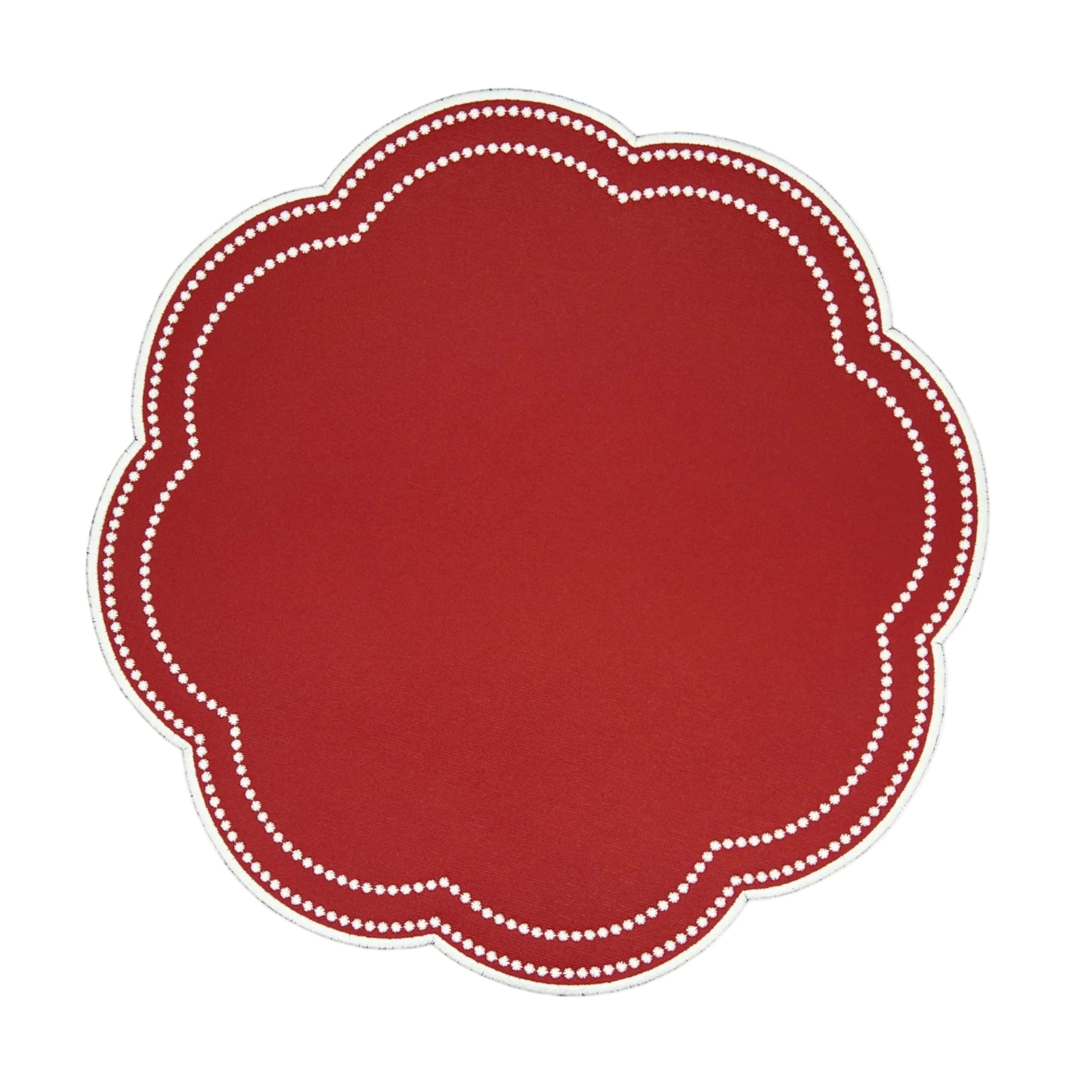 Red placemat with white scalloped edge on a white background