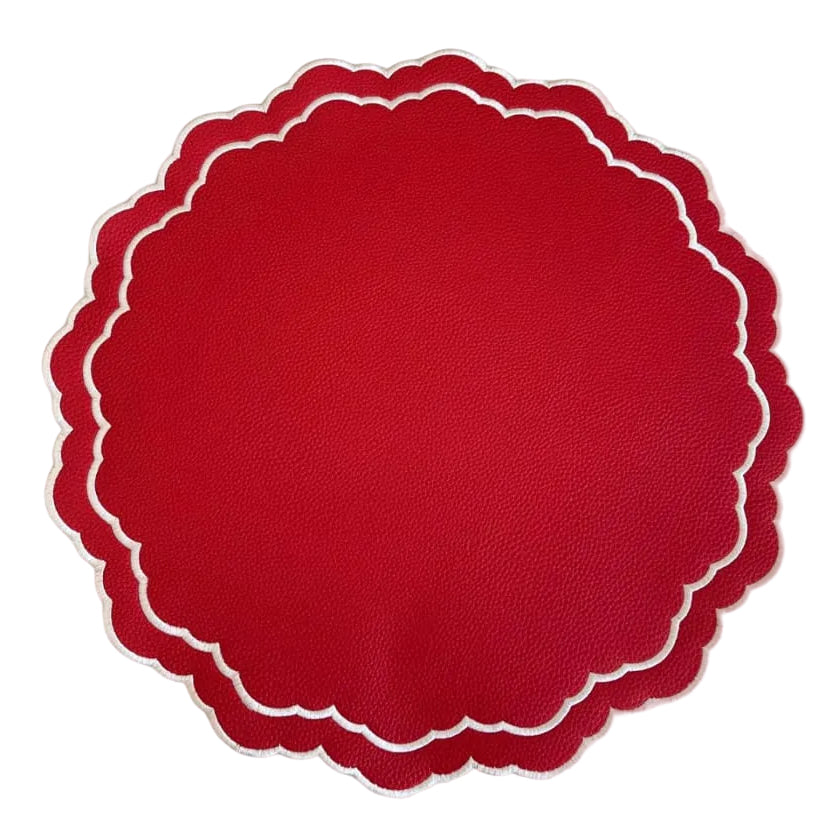 Red scalloped-edge paper on a white background