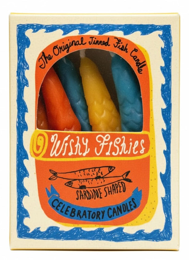 Box of colorful candles shaped like fish with 'Wishy Fishies' branding.