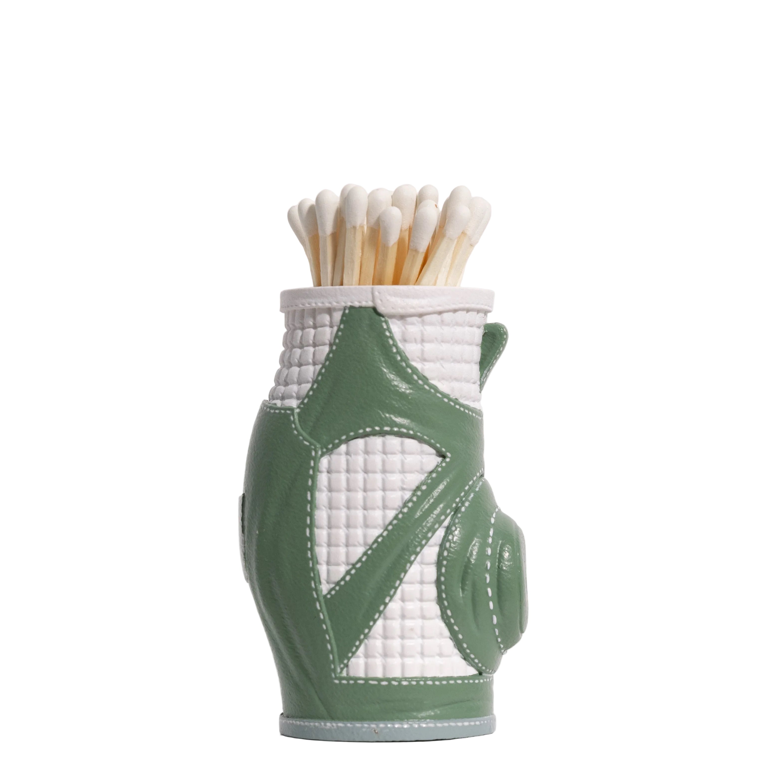 Matches in a green and white quilted match striker on a white background