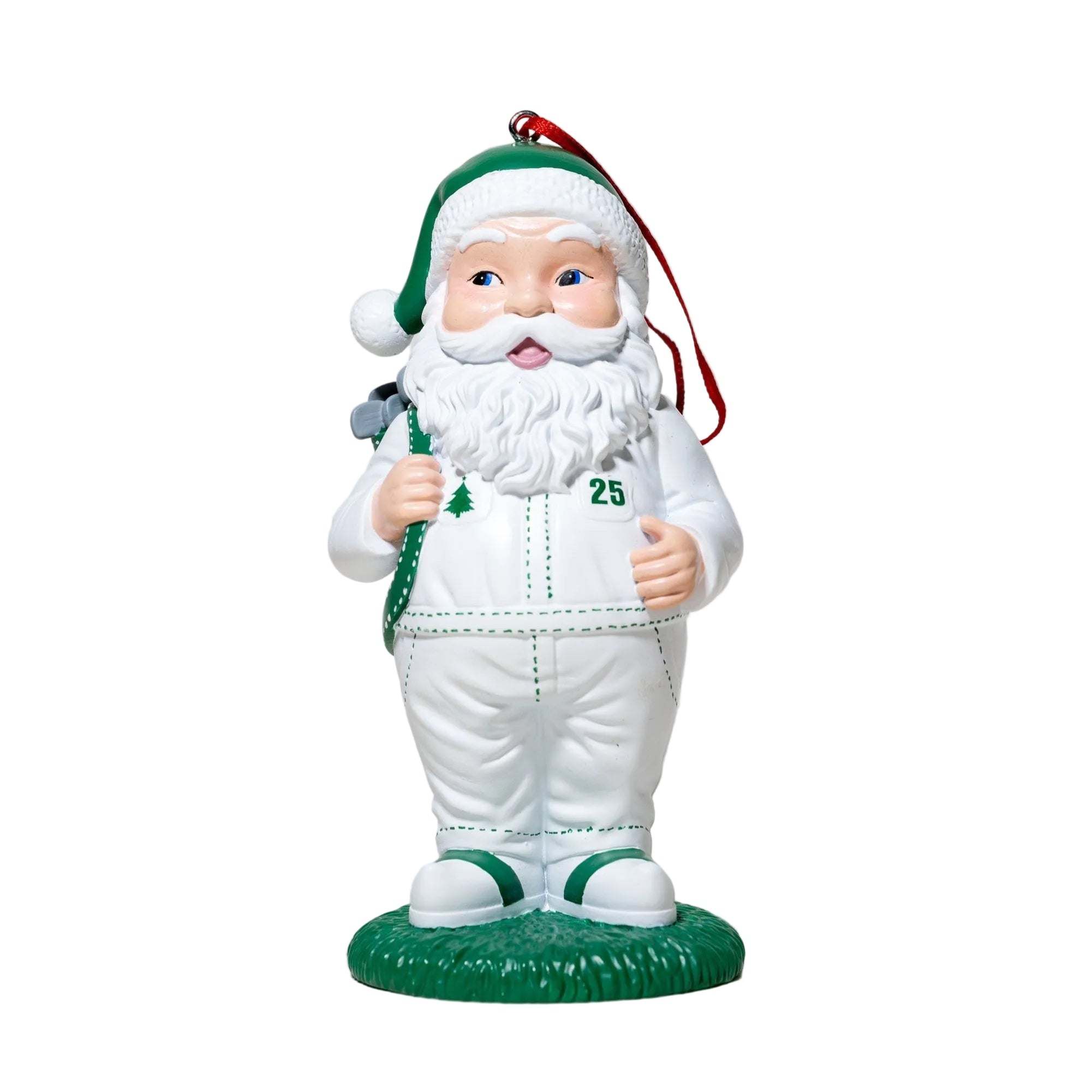 Santa Claus figurine with a green hat and scarf on a light gray background