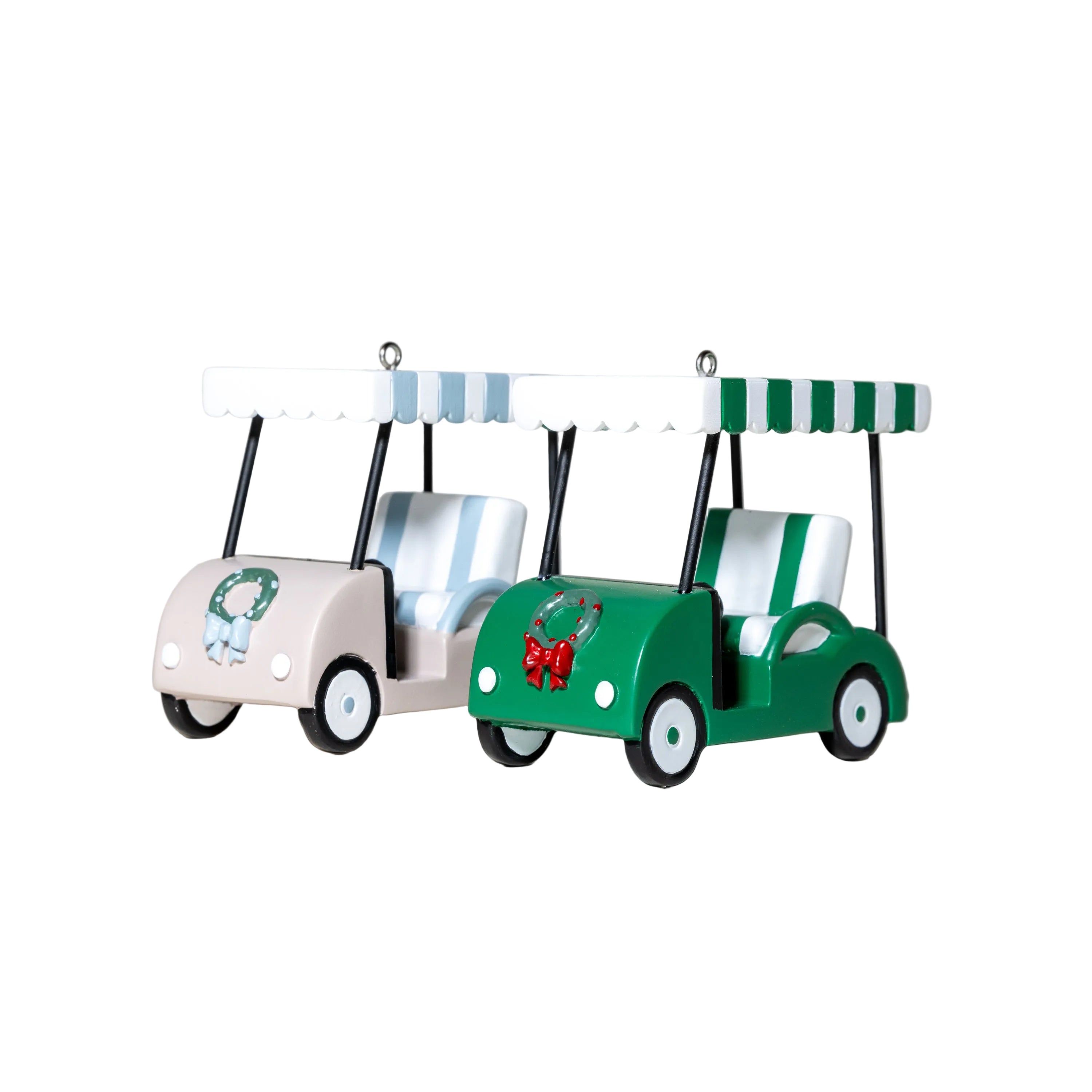 Two toy golf carts, one pink and one green with a red bow, on a light gray background.
